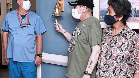 Cancer bell being rung by VA patient Anthony Thomas at Edward Hines Jr. VA Hospital. Read more https://news.va.gov/90427/cancer-patients-final-treatment-ends-victory-bell/