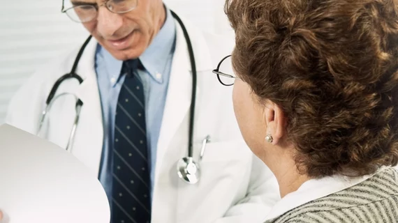 A doctor speaking with a patient